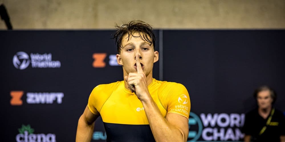 Chase signaling silence to the crowd after a World Triathlon race.
